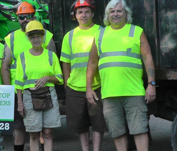Tree Top Climbers crew in front of truck